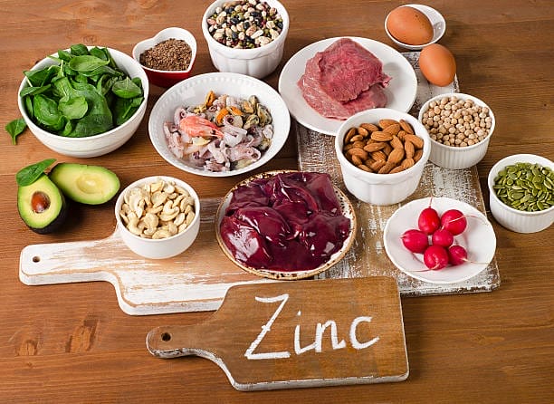 Zinc 2 foods with zinc mineral on a wooden table